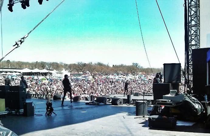 View from stage of a massive outdoor festival crowd